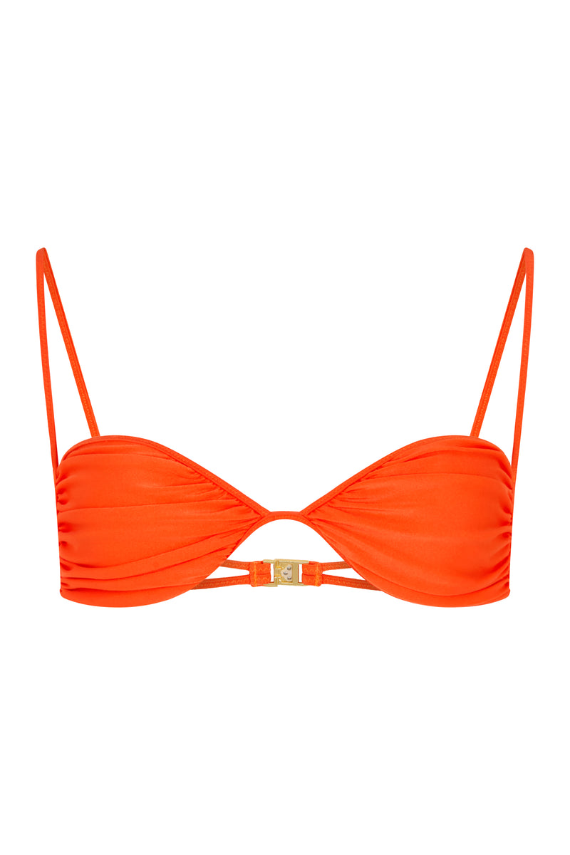 An orange bralette bikini top with adjustable straps and ruched cup detail, featuring brushed vintage gold hardware.