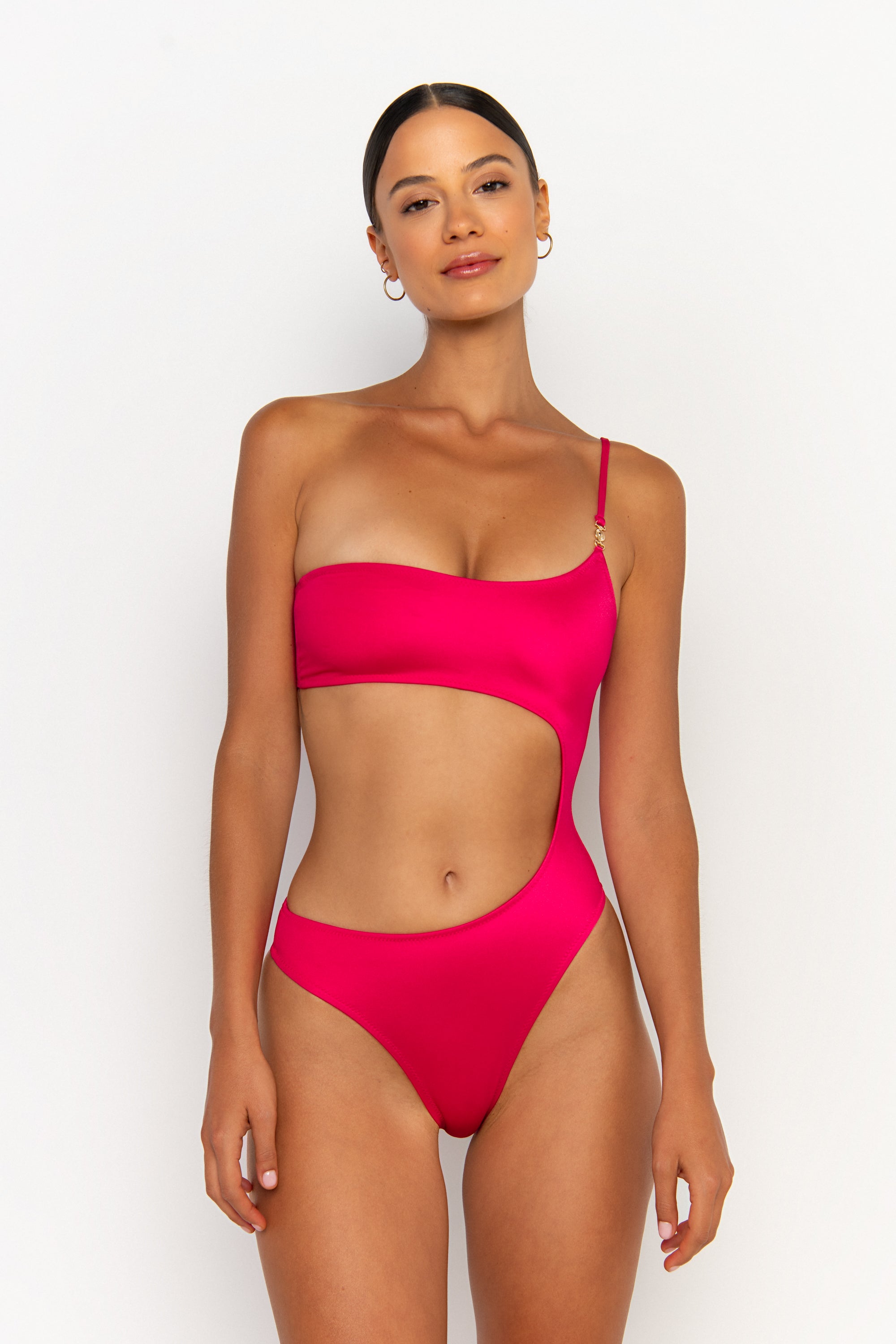 front view elegant woman wearing luxury swimsuit from sommer swim - bonita magenta is an fuchsia one piece one shoulder swimsuit