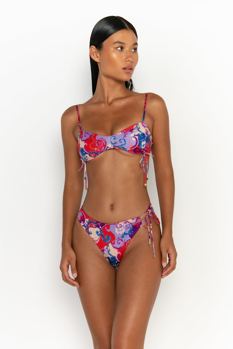 elegant woman wearing luxury swimsuit from sommer swim - adriana rococo is a print bikini with high waisted bikini bottom