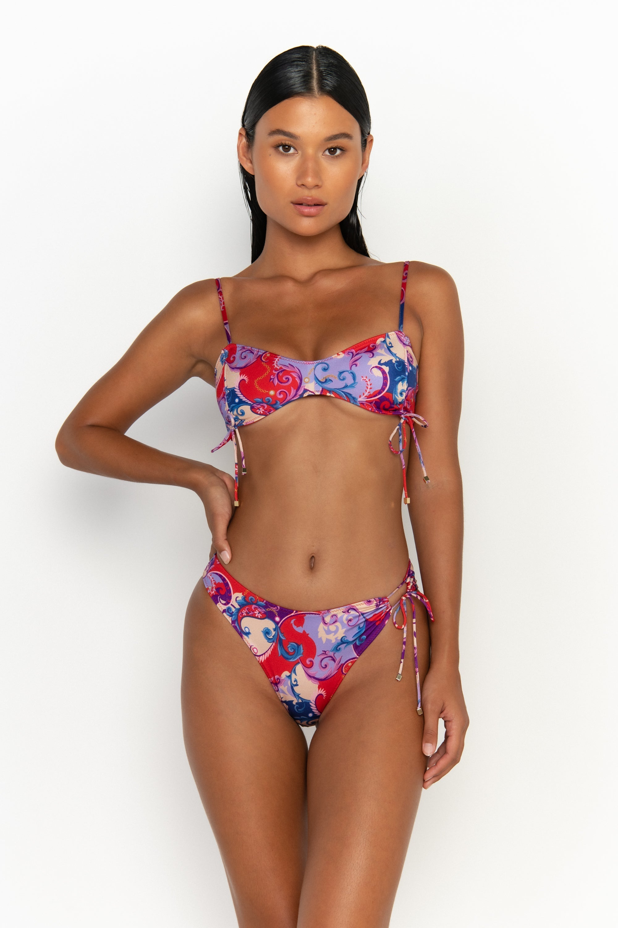 front view elegant woman wearing luxury swimsuit from sommer swim - bea rococo is a print bikini with bralette bikini top