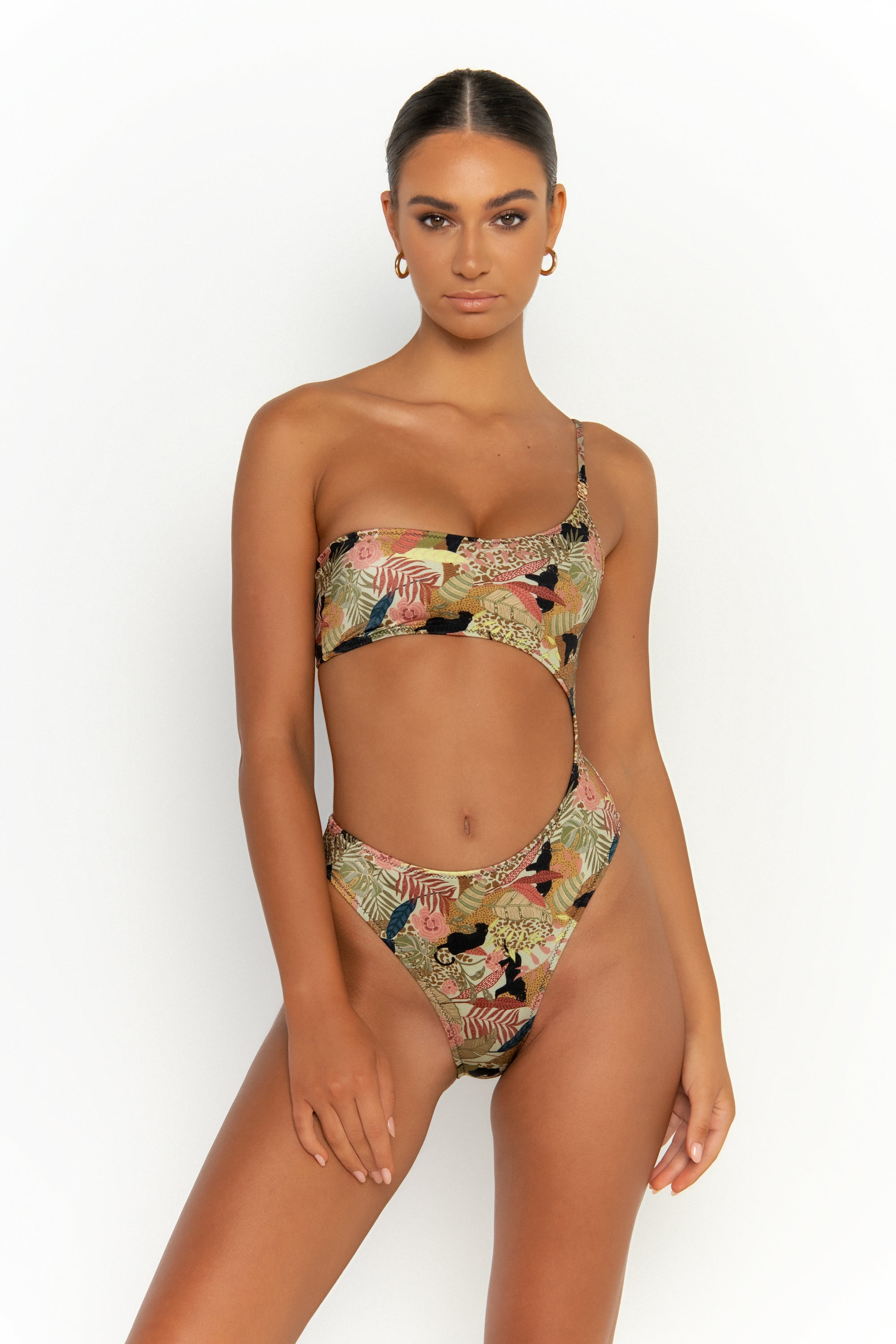 front view elegant woman wearing luxury swimsuit from sommer swim - bonita jaguar is an print one piece one shoulder swimsuit