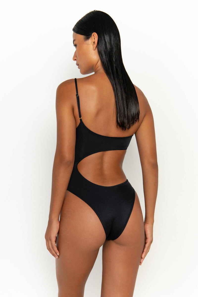 back view elegant woman wearing luxury swimsuit from sommer swim - bonita nero is an black one piece one shoulder swimsuit