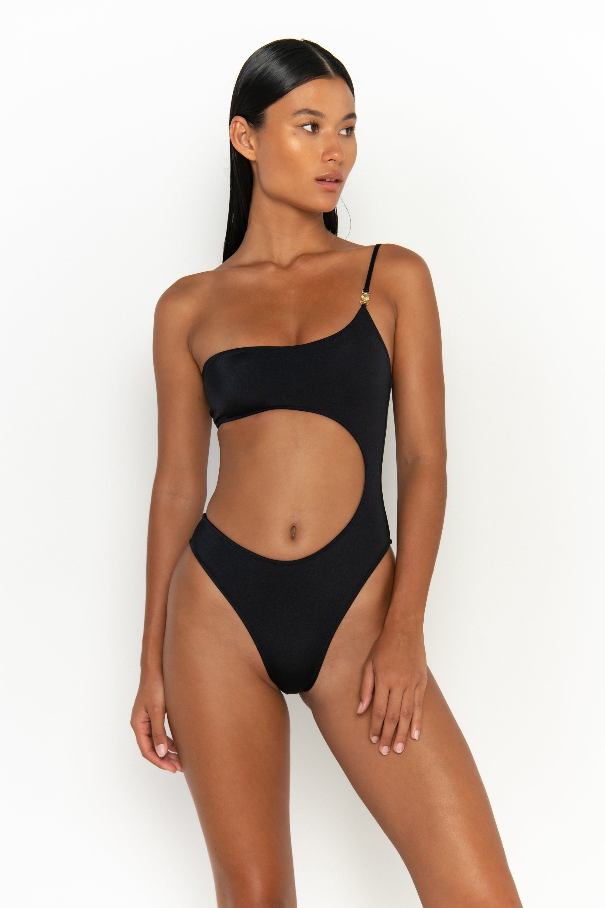 front view elegant woman wearing luxury swimsuit from sommer swim - bonita nero is an black one piece one shoulder swimsuit