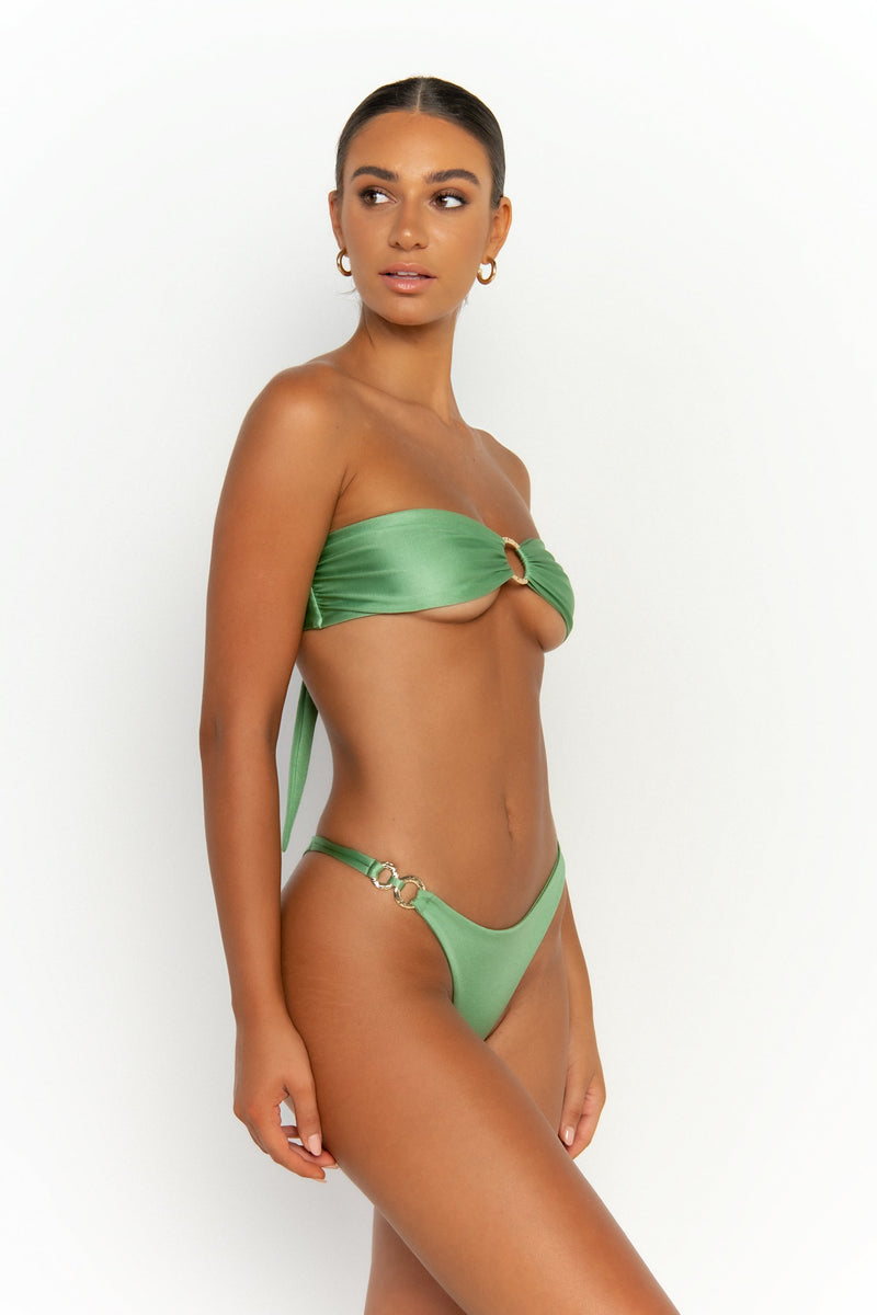 side view elegant woman wearing luxury swimsuit from sommer swim - cece maltese is a mint green bikini with a bandeau bikini top