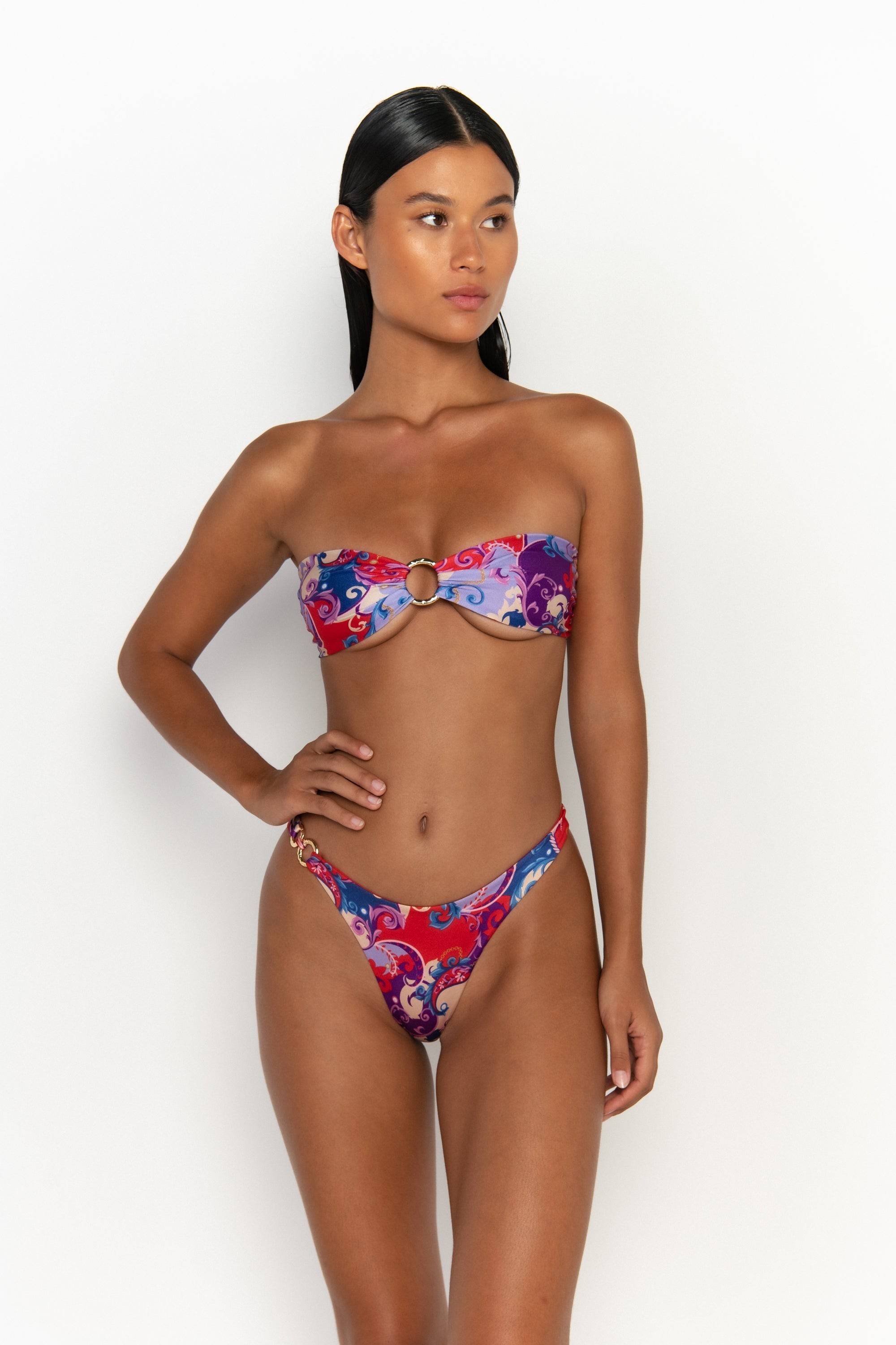 front view elegant woman wearing luxury swimsuit from sommer swim - cece rococo is a print bikini with a bandeau bikini top