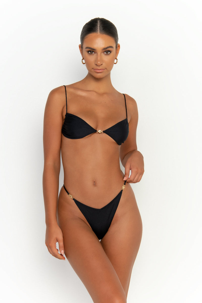 front view elegant woman wearing luxury swimsuit from sommer swim - ella nero is a black bikini with bralette bikini top