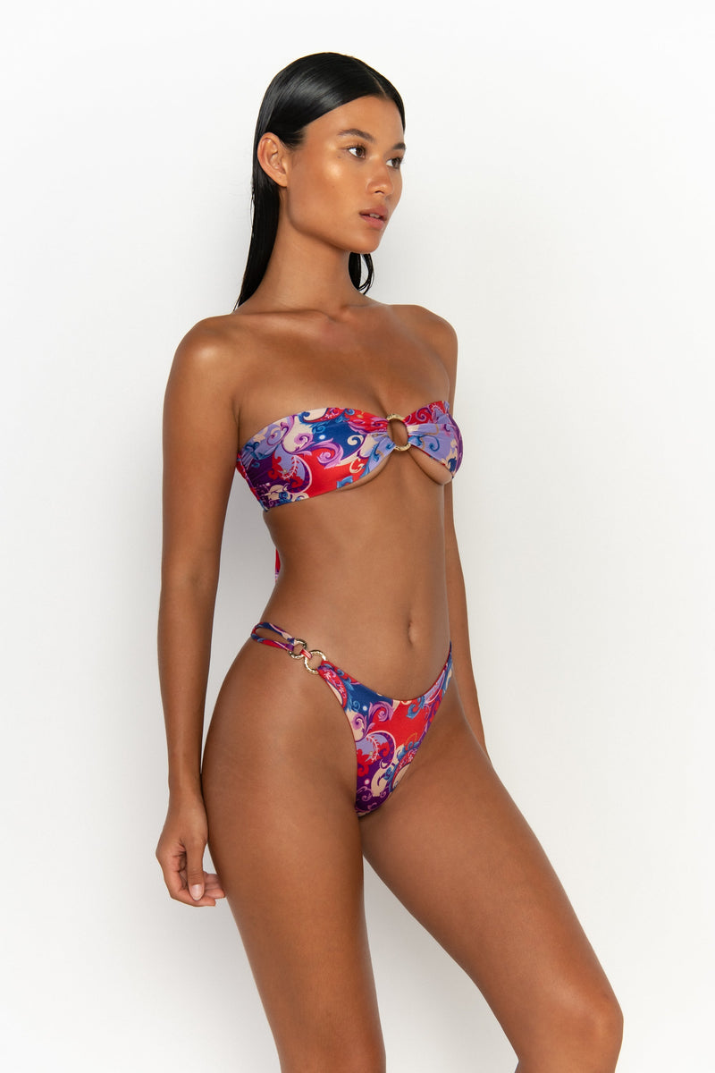side view elegant woman wearing luxury swimsuit from sommer swim - gigi rococo is a print bikini with cheeky bikini bottom