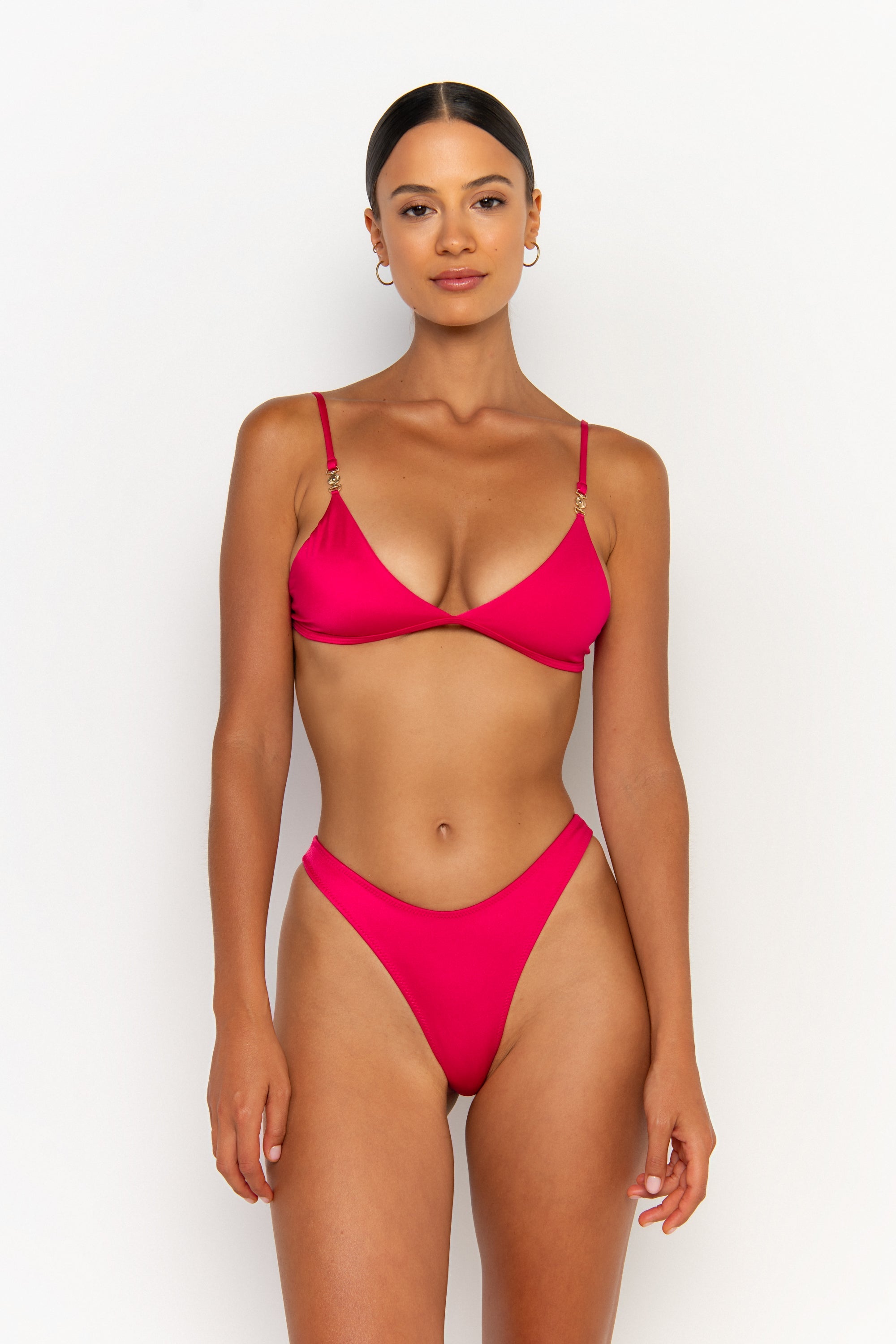 front view elegant woman wearing luxury swimsuit from sommer swim - juliet magenta is a fuchsia bikini with bralette bikini top