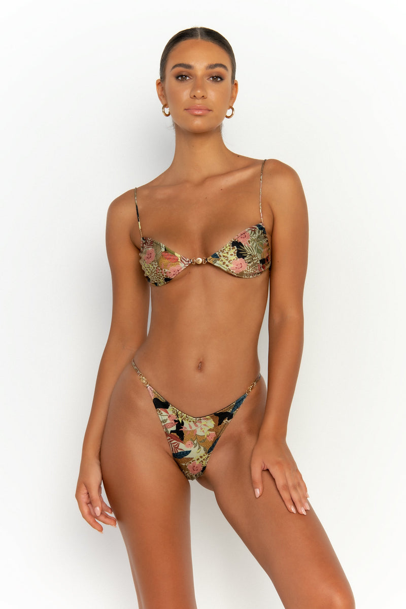 front view elegant woman wearing luxury swimsuit from sommer swim - lia jaguar is a print bikini with brazilian bikini bottom