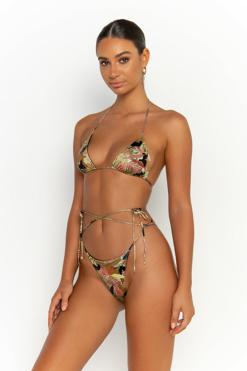 side alternative view elegant woman wearing luxury swimsuit from sommer swim - milla jaguar is a print bikini with tie side bikini bottom