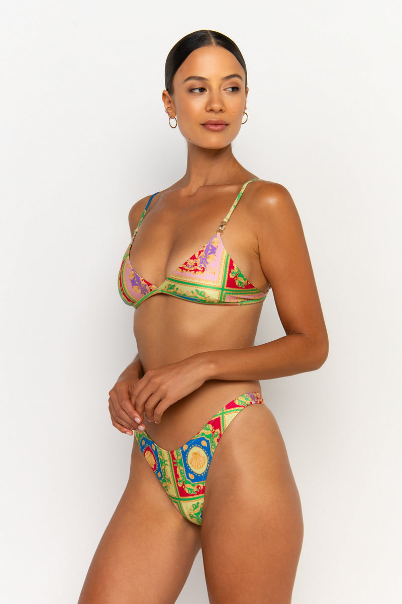side view elegant woman wearing luxury swimsuit from sommer swim - niam posidonia is a print bikini with thong bikini bottom