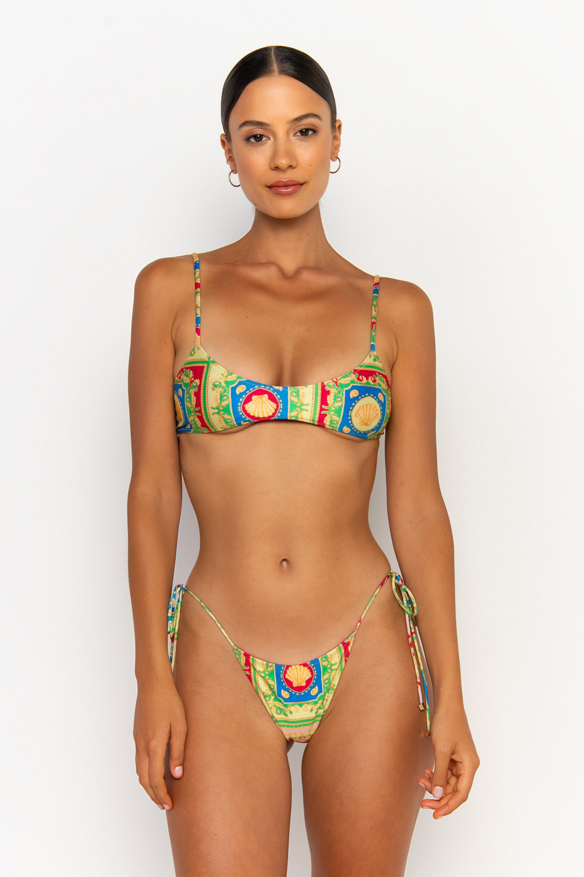 front view elegant woman wearing luxury swimsuit from sommer swim - pilar posidonia is a print bikini with bralette bikini top