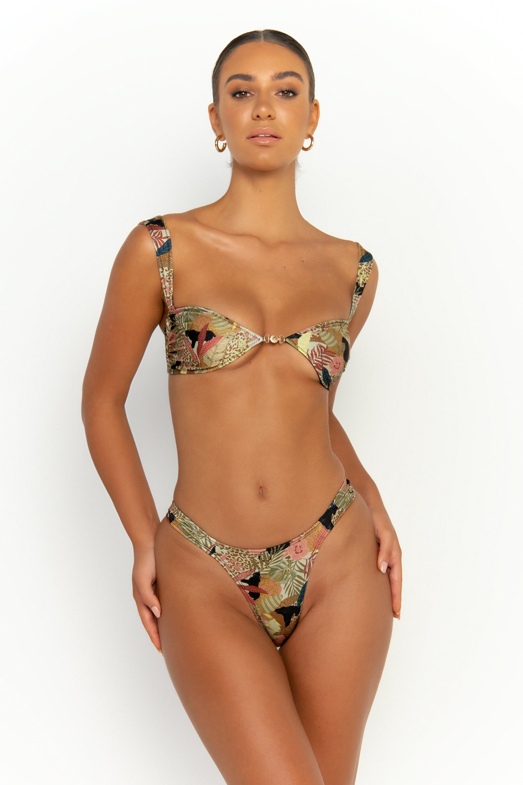 front view elegant woman wearing luxury swimsuit from sommer swim - soriya jaguar is a print bikini with balconette bikini top