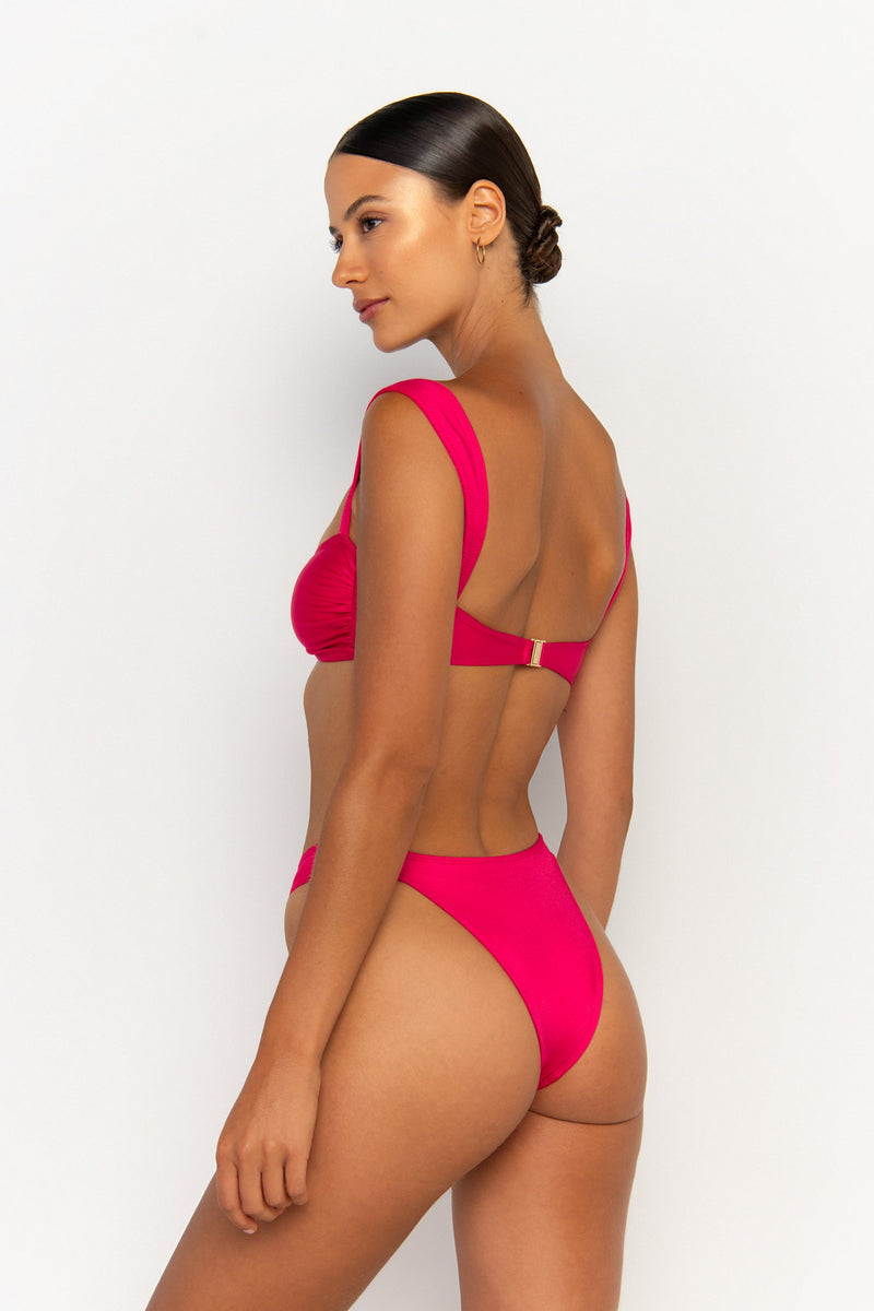 back view elegant woman wearing luxury swimsuit from sommer swim - soriya magenta is a fuchsia bikini with balconette bikini top