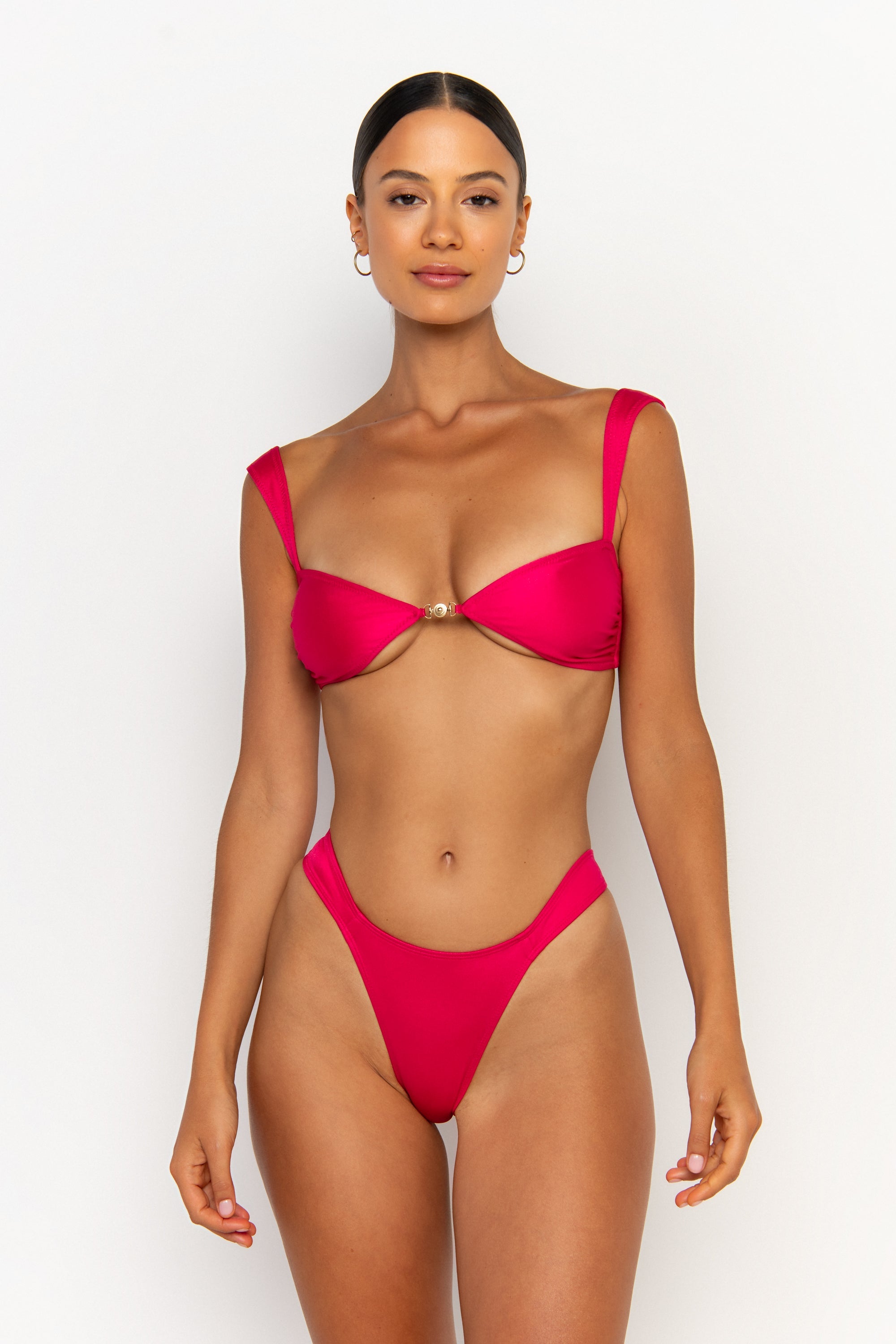 front view elegant woman wearing luxury swimsuit from sommer swim - soriya magenta is a fuchsia bikini with balconette bikini top