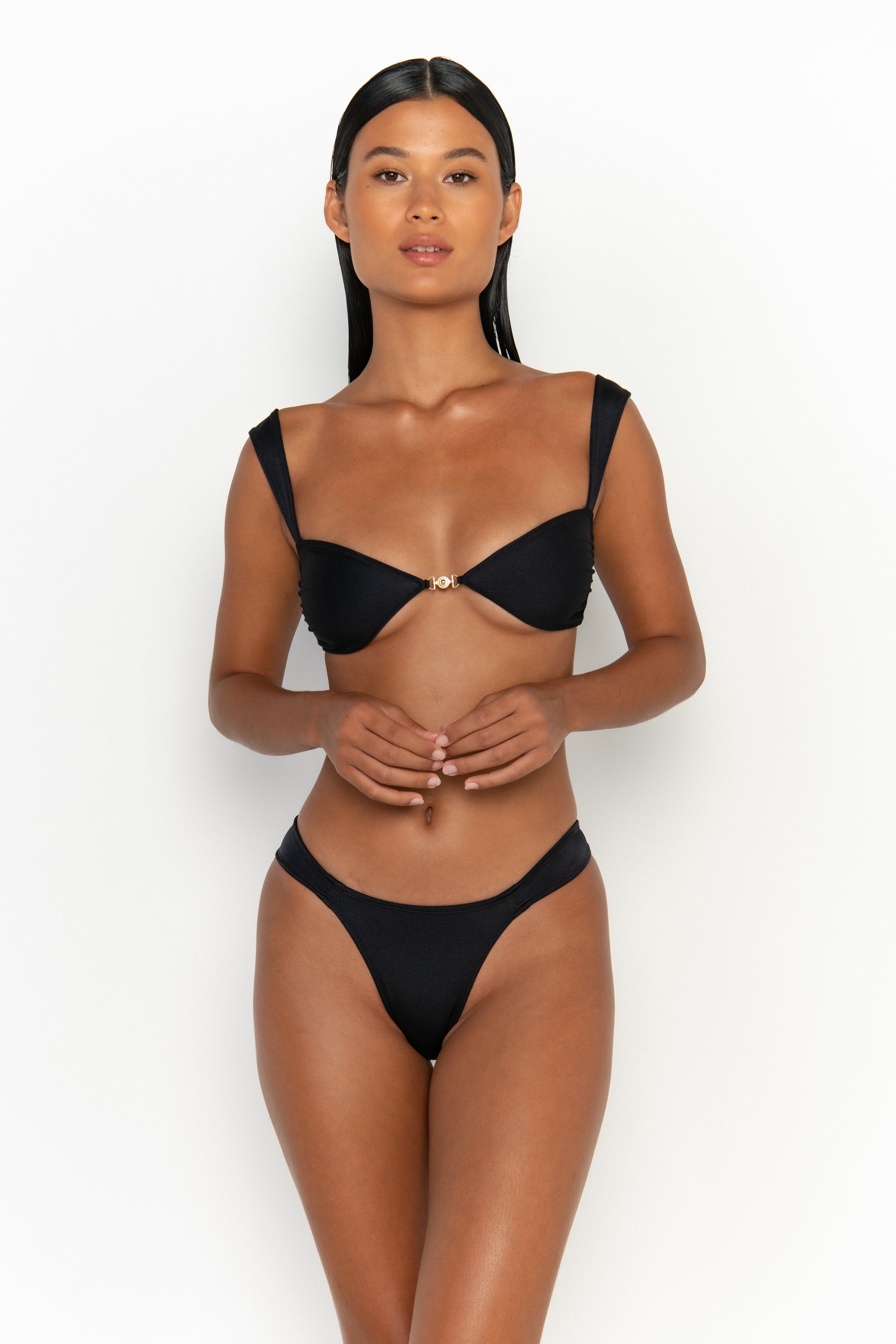 front view elegant woman wearing luxury swimsuit from sommer swim - soriya nero is a black bikini with balconette bikini top