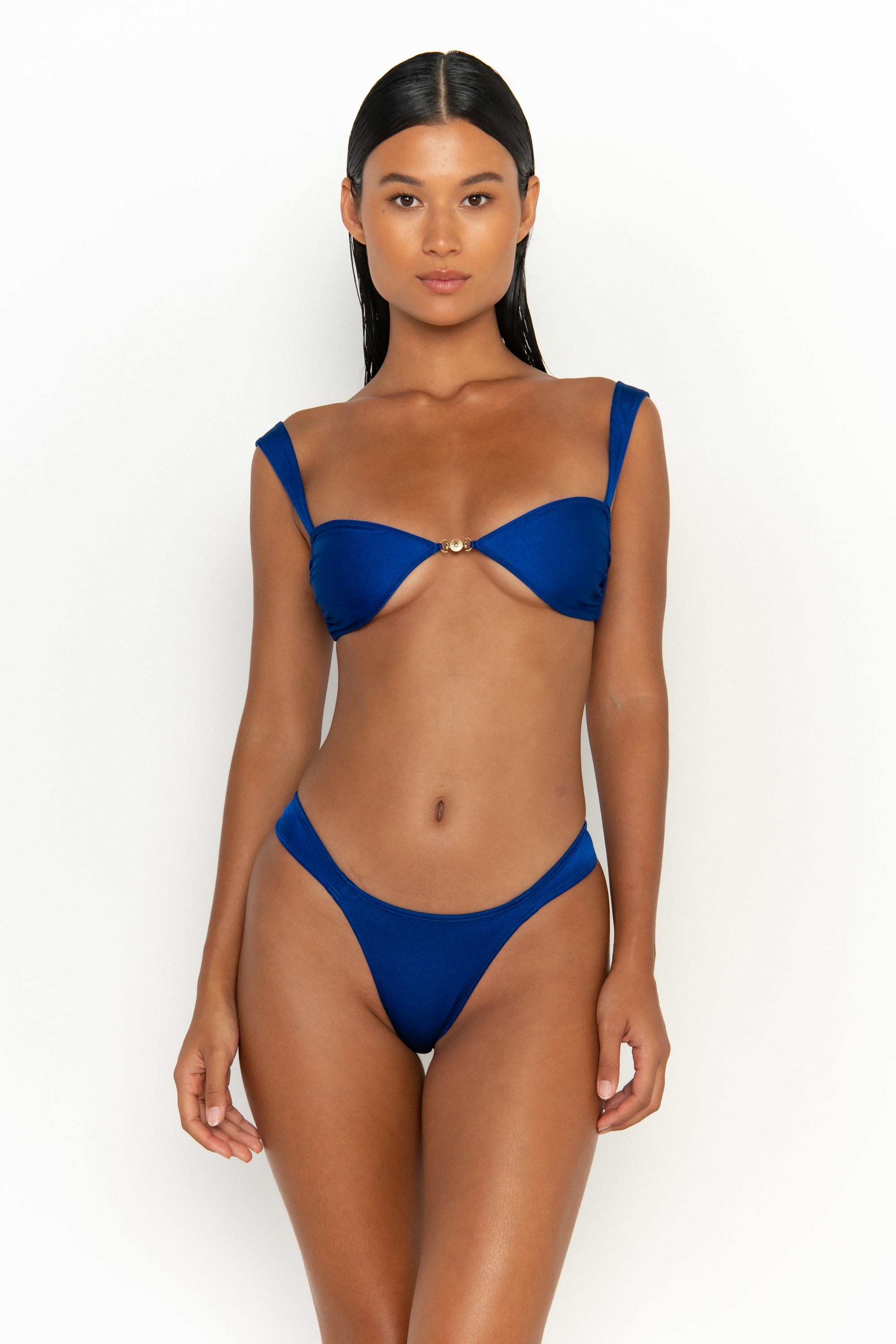 front view elegant woman wearing luxury swimsuit from sommer swim - soriya olympus is a royal blue bikini with balconette bikini top