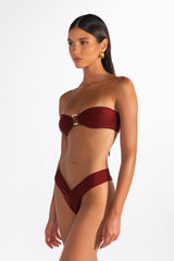 model wearing vintage gold ring bandeau bikini top
