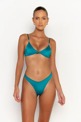 front view elegant woman wearing luxury swimsuit from sommer swim - juliet blue fondale is an aqua blue bikini with bralette bikini top