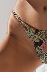 model close up front view elegant woman wearing luxury swimsuit from sommer swim - lia jaguar is a print bikini with brazilian bikini bottom