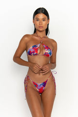 front view elegant woman wearing luxury swimsuit from sommer swim - celene rococo is a print bikini with a halter style bikini top